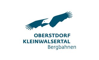 A logo featuring a stylized eagle hovering above the inscription "Oberstdorf Kleinwalsertal Bergbahnen." The design is simple and clear, with a blue color palette. | © OBERSTDORF · KLEINWALSERTAL BERGBAHNEN