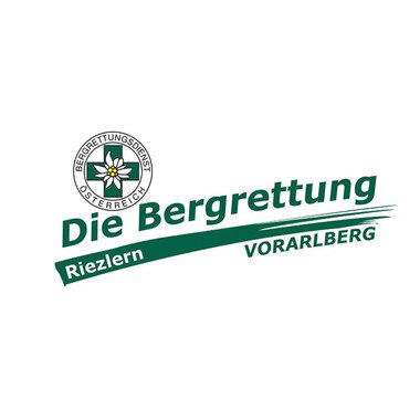 Das Bild zeigt das Logo des Bergrettungsdienstes Österreich. Es ist mit den Worten "Die Bergrettung Riezlern Vorarlberg" sowie einem Emblem mit einer Blume gestaltet. | © Bergrettung Vorarlberg