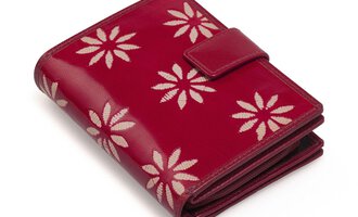 A red wallet with a floral pattern. It features a practical closure and an elegant design.