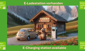 A charming pizzeria in a mountainous setting with an E-charging station and a cheerful bear. A vintage car parks in front of it, surrounded by a picturesque landscape.