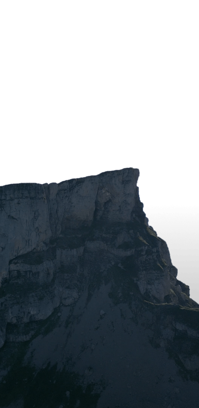 Jagged mountain peak against a bright, white background.